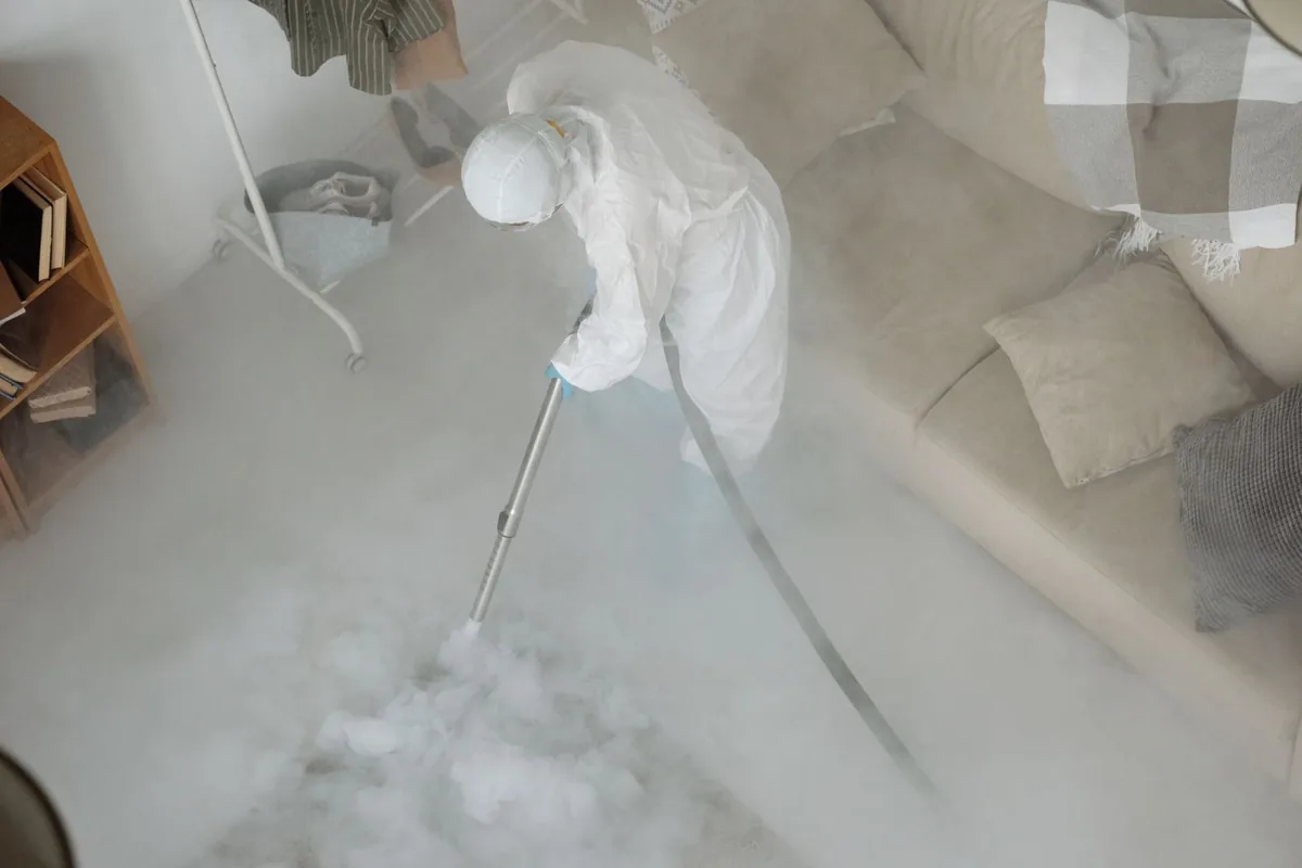 Biohazard cleanup technician in protective equipment, Flemington, NJ